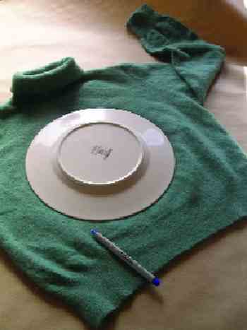 STEP 2: Trace around a dinner plate with a pen or colored pencil. The average sweater will yield four large circles, one each from the front, back, and both sleeves. A cardigan will probably only yield three, a vest two.